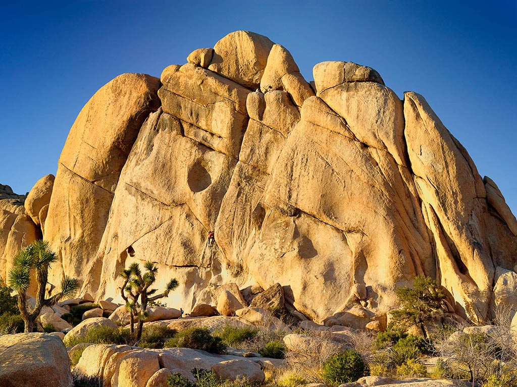 Climbers on Old Woman Rock Formation in Joshua Tree.